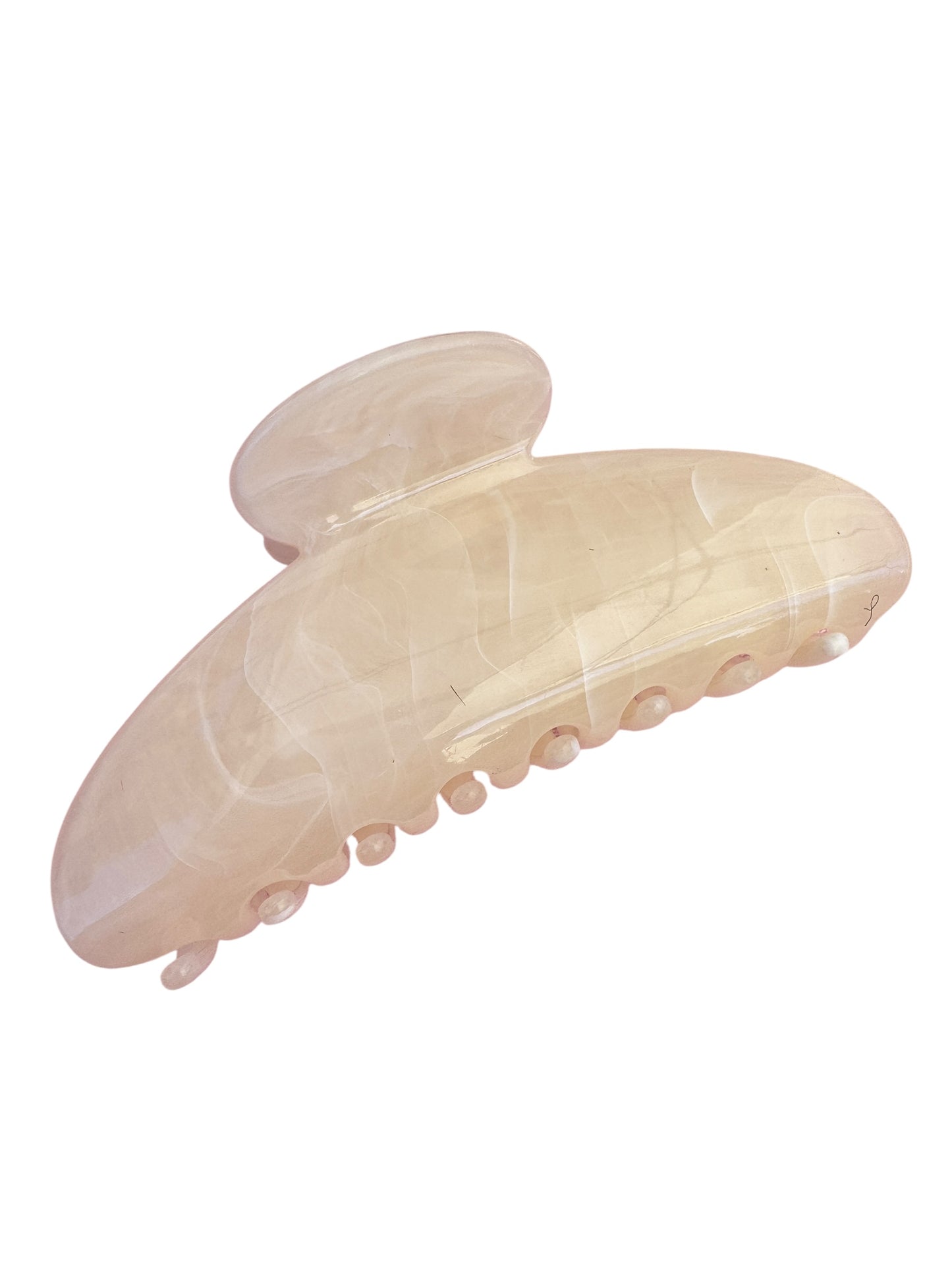 Beige hair clip on a white background