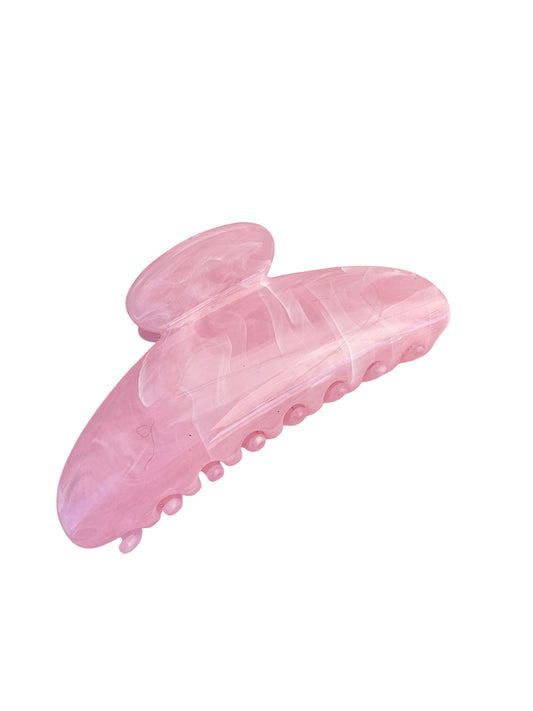 Pink hair clip on a white background