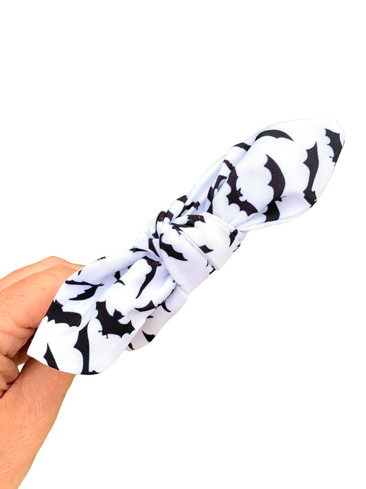 white headband with black bats