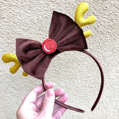 reindeer headband with gold antlers brown velvet bow and red shiny nose